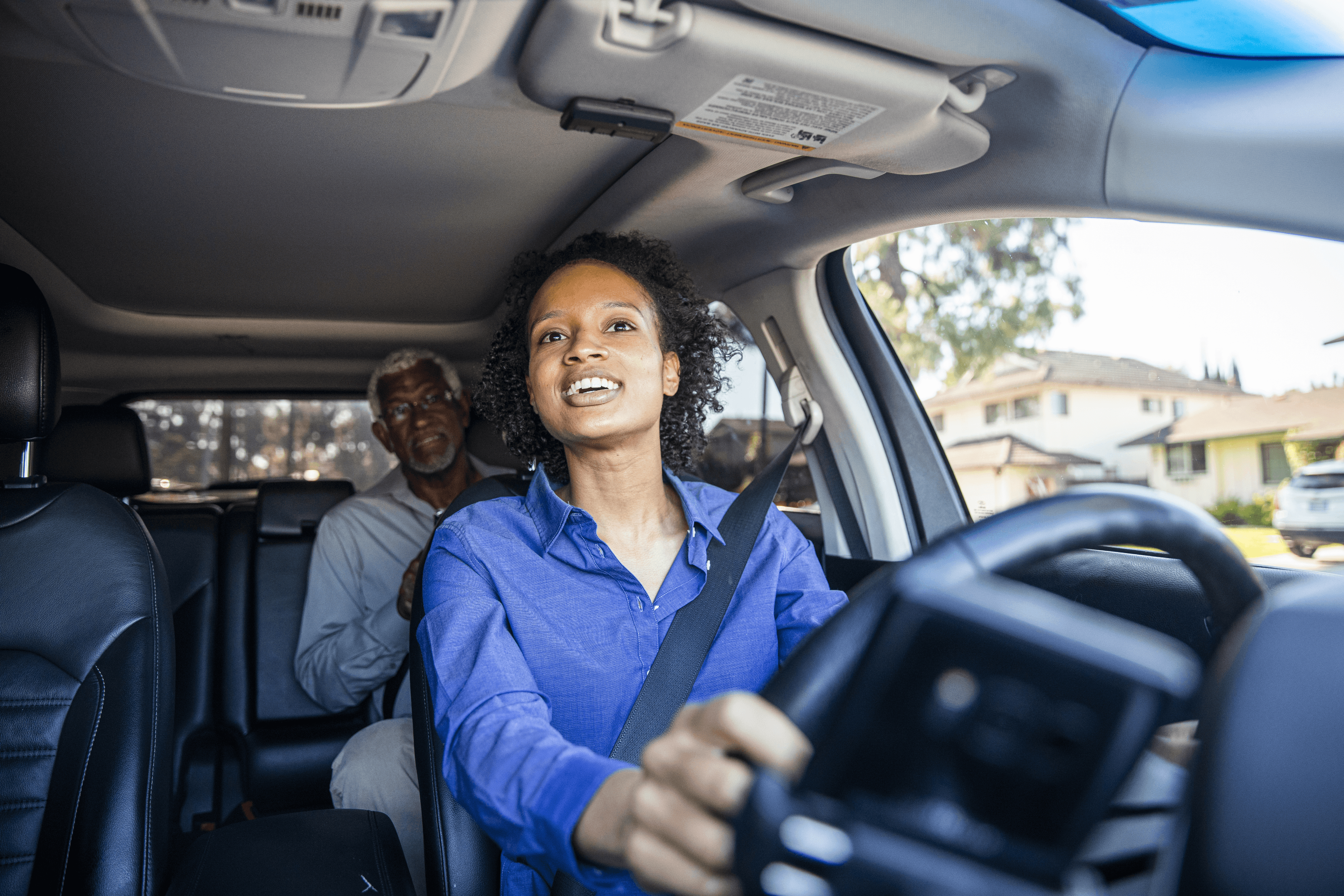 A professional driver transporting a passenger