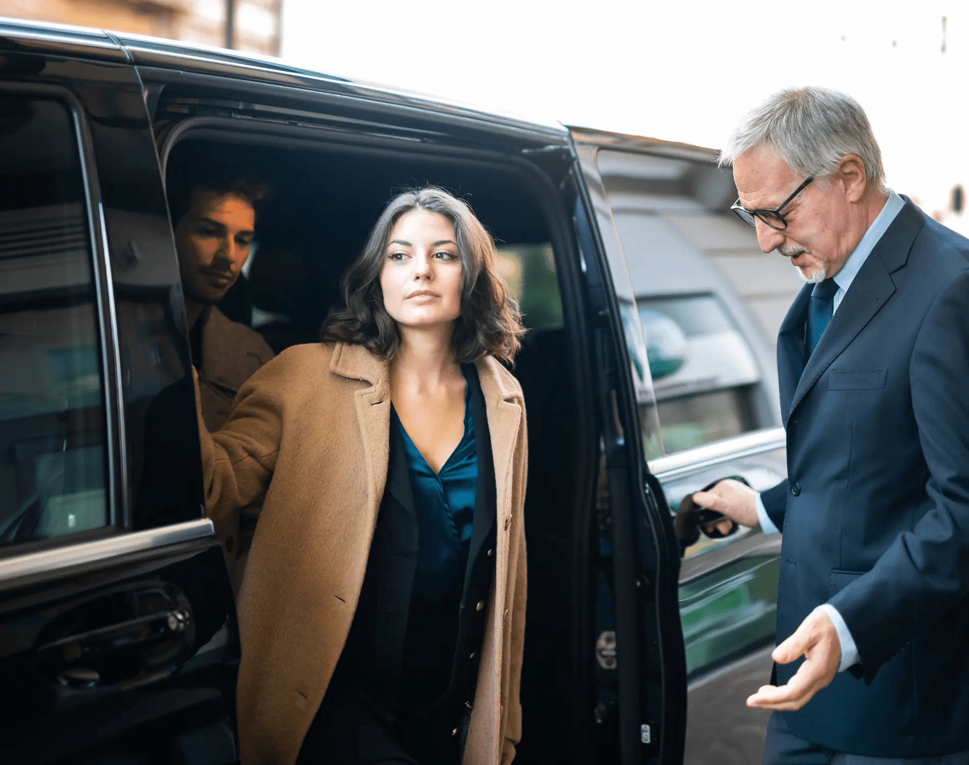 Chauffeur opening the door for a passenger.