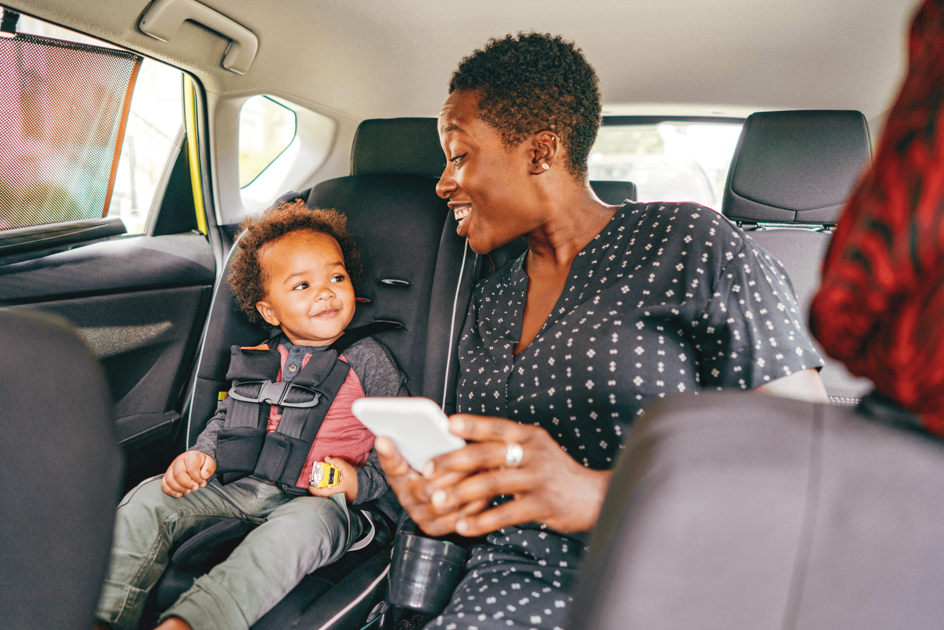 A parent and child using a recurring transport service