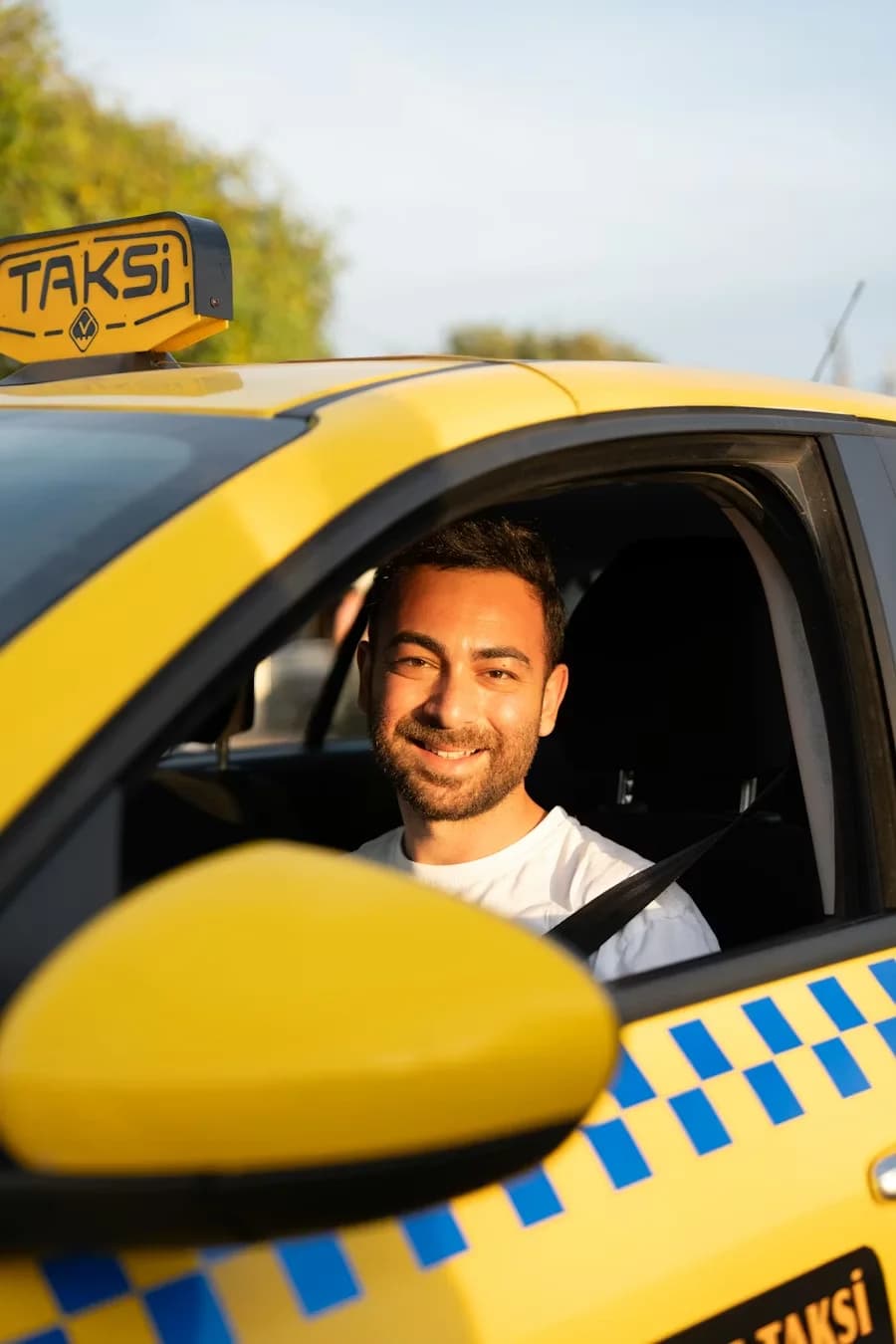 A professional driver in a yellow vehicle