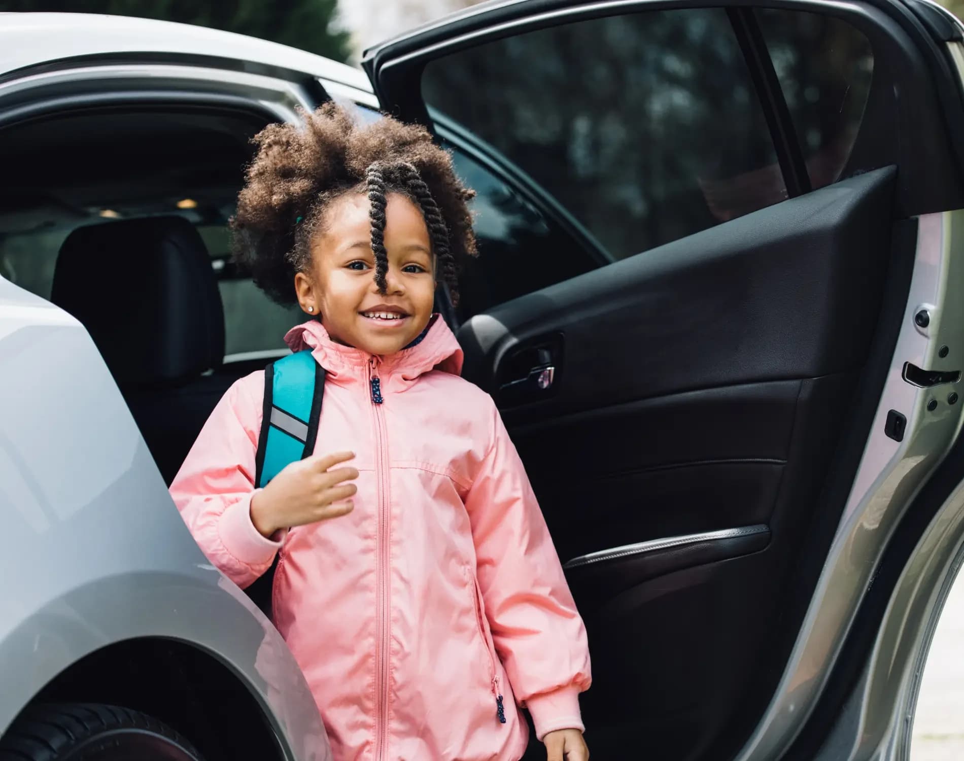 A child arriving for a recurring school transport service